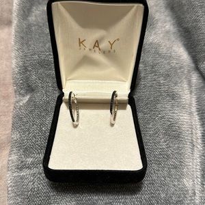Kay jewelers small hoops. Half of the hoop is black stones.